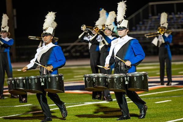 Brentwood High band members play on the football field